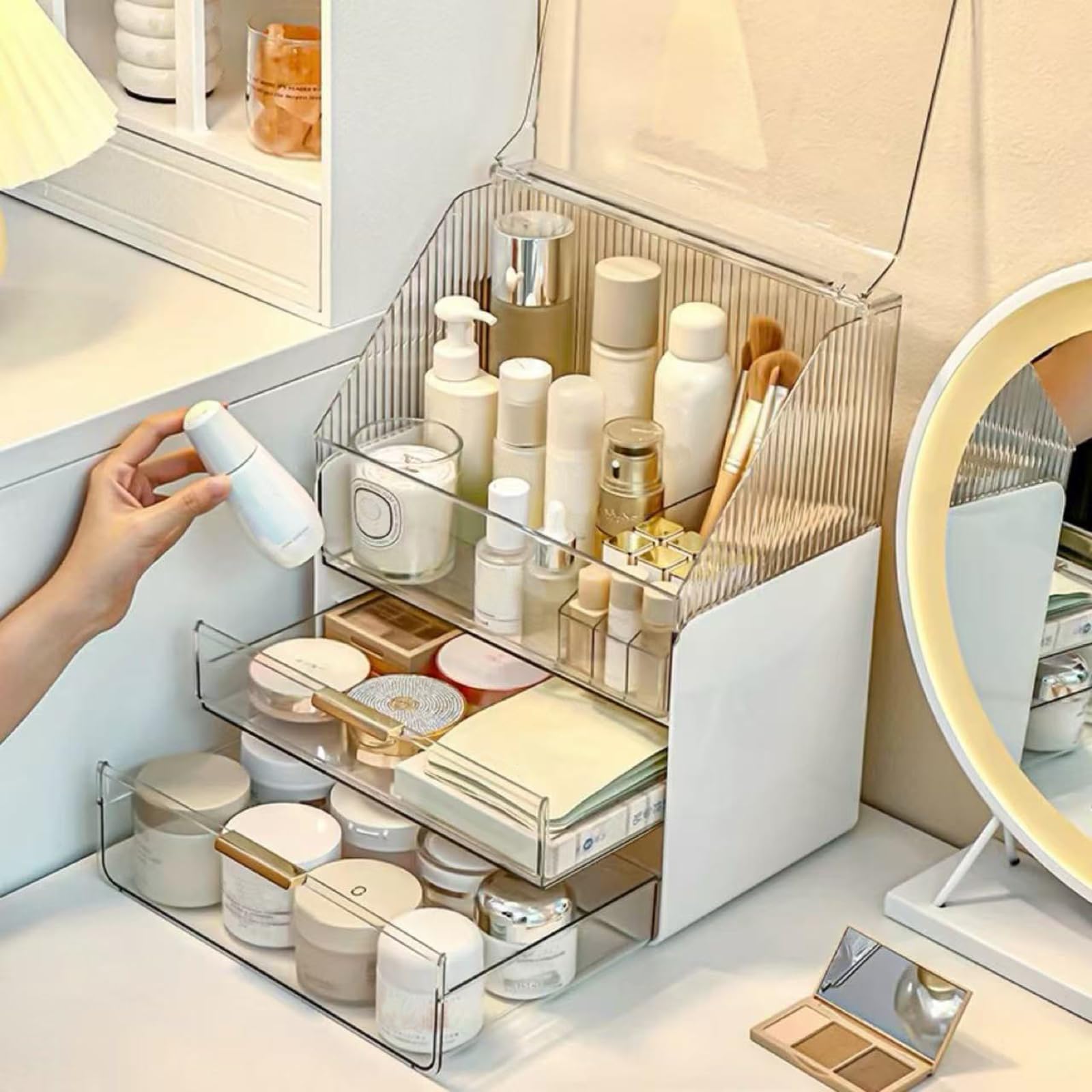 Omeily interior showing three-layer storage holding skincare and makeup