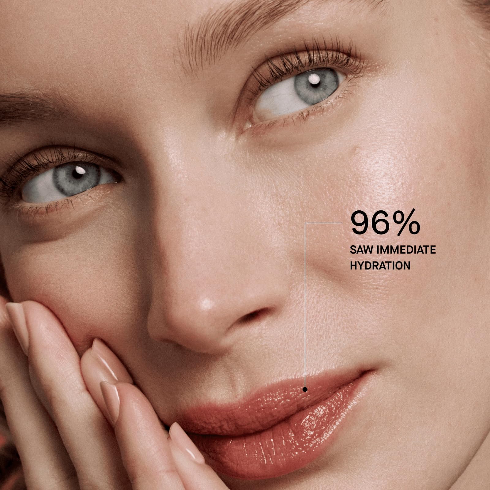 Model applying OneSkin OS-01 lip balm demonstrating sun protection and natural finish