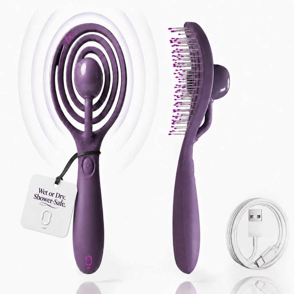 OO! brush front view showing ergonomic grip and detangling surface for easier brushing