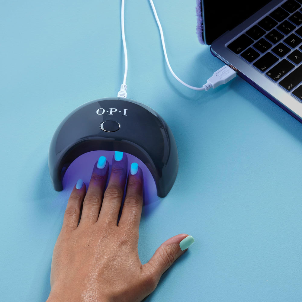OPI GELement base coat in a salon setting with tools, illustrating professional-quality at-home performance