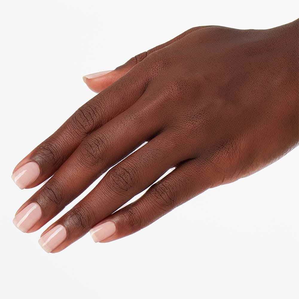 OPI applied on natural nails showing neutral glossy finish and professional look