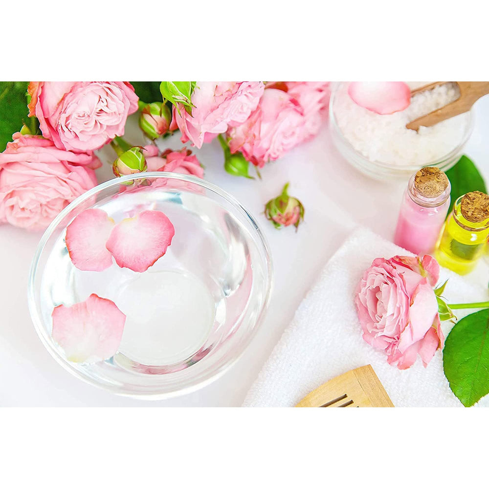 OPO rose hydrosol next to spray bottle showing convenient decanting benefit