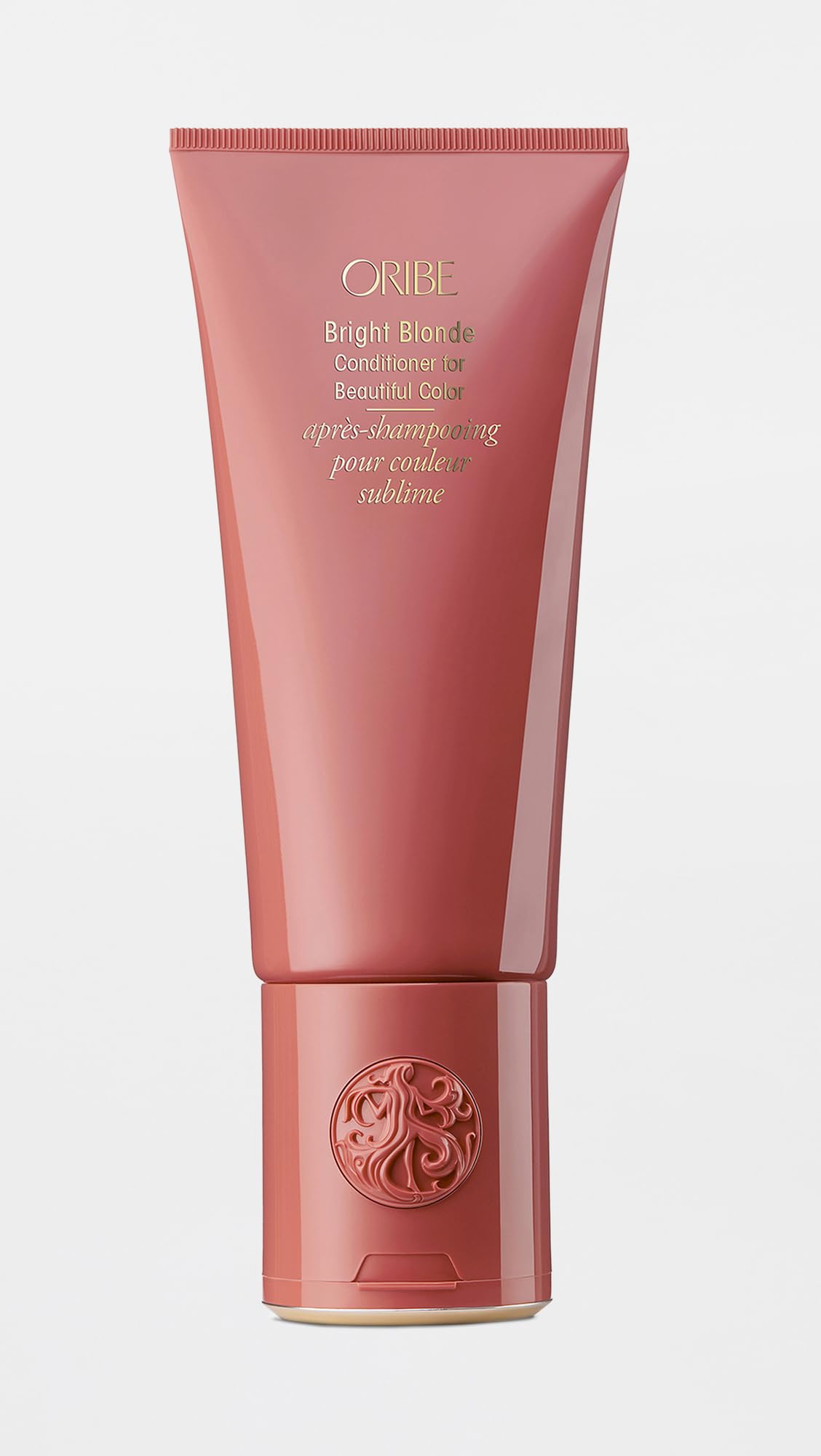 Oribe Bright Blonde conditioner in bathroom lifestyle demonstrating ease of use and visibly brighter, softer blonde hair