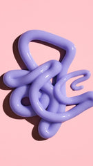 Oribe Bright Blonde conditioner creamy violet texture close-up showing pigment and smoothing benefit for brassiness