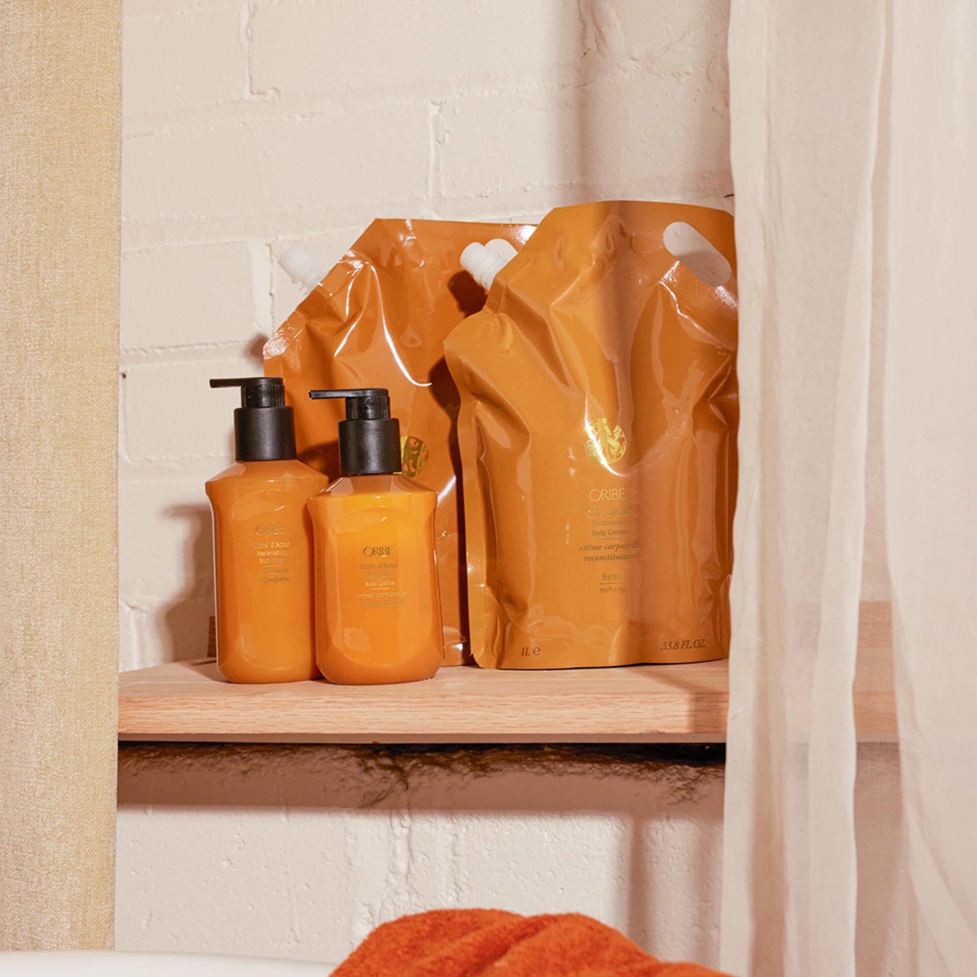 ORIBE lather on hand demonstrating rich foam and gentle cleansing benefit