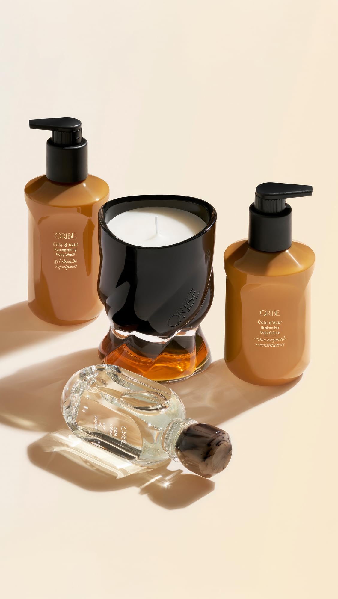 ORIBE 10.1oz bottle next to common toiletry for scale, clear size benefit