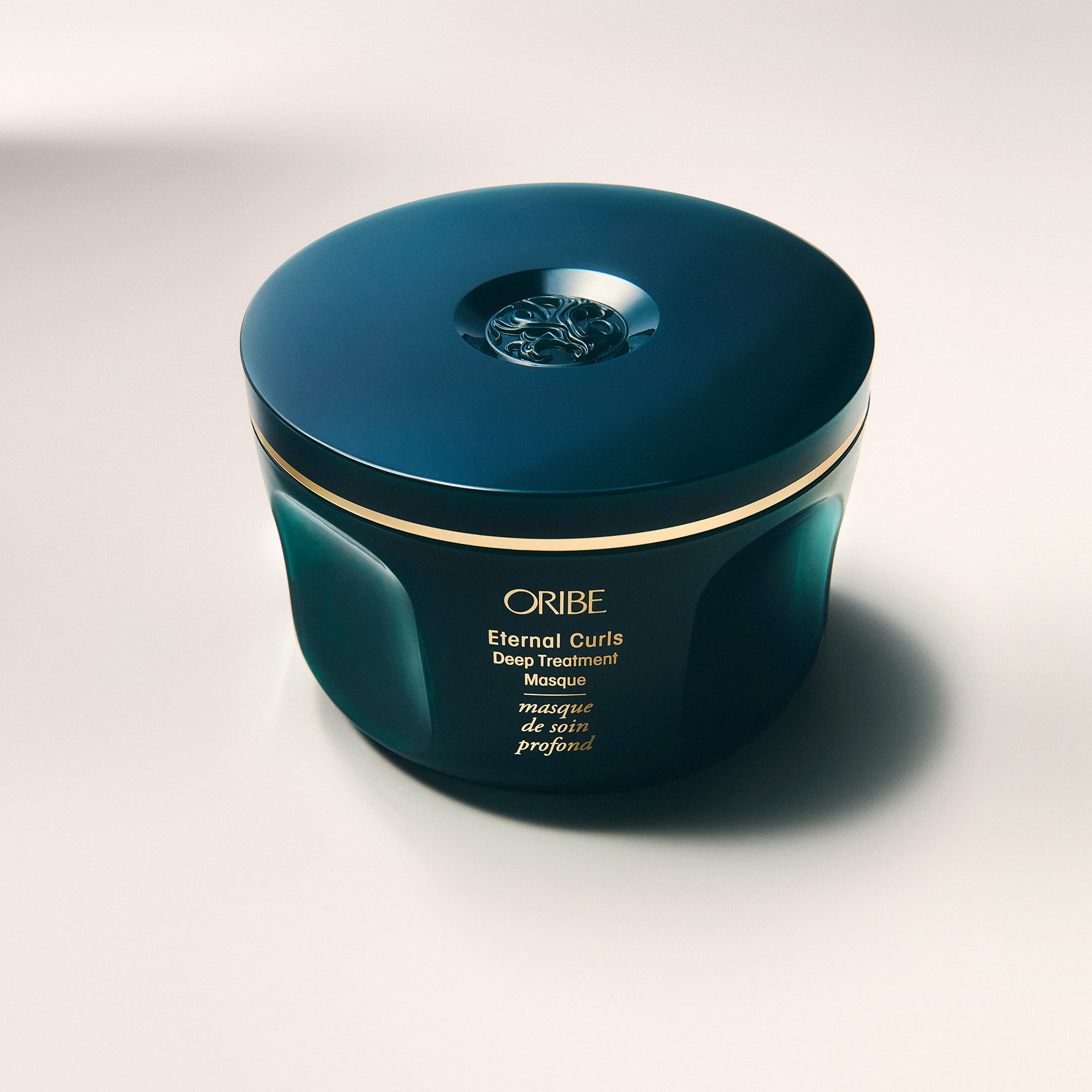 ORIBE product label close-up showing directions and ingredient callouts