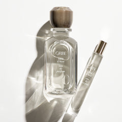 ORIBE fragrance notes graphic illustrating bergamot, white butterfly jasmine, and sandalwood benefits