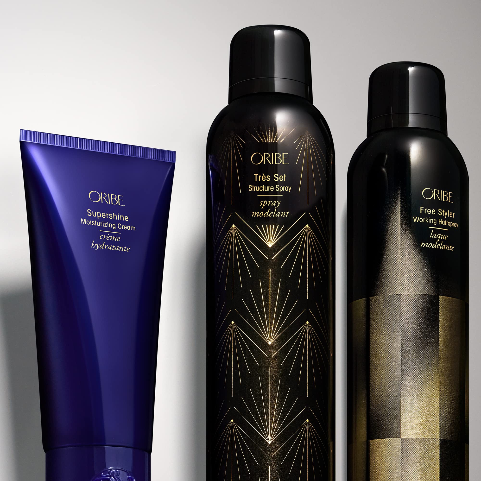 ORIBE Free Styler being applied to styled hair on model for touchable, brushable finish