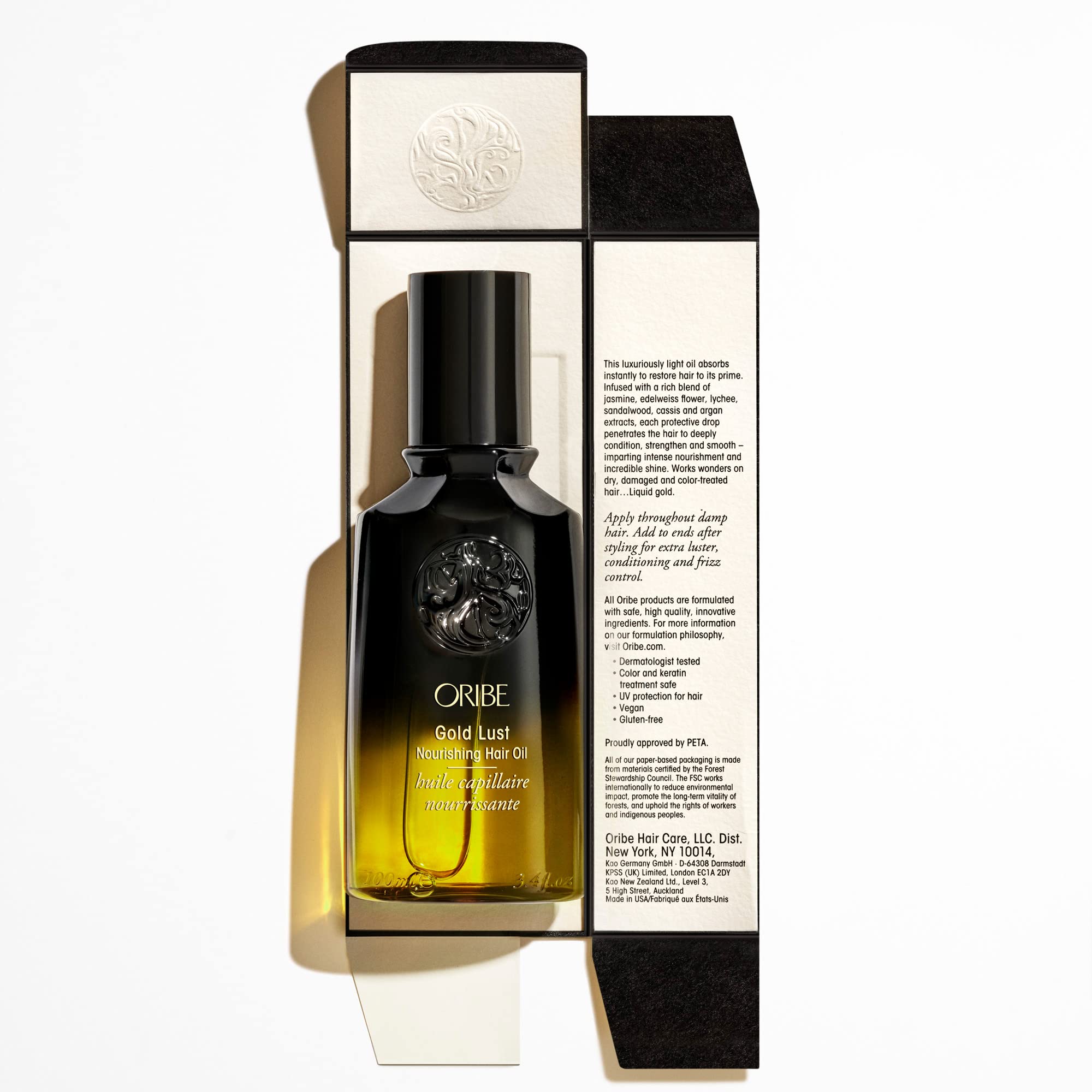 Oribe oil on bathroom shelf in lifestyle scene showing everyday luxury benefit