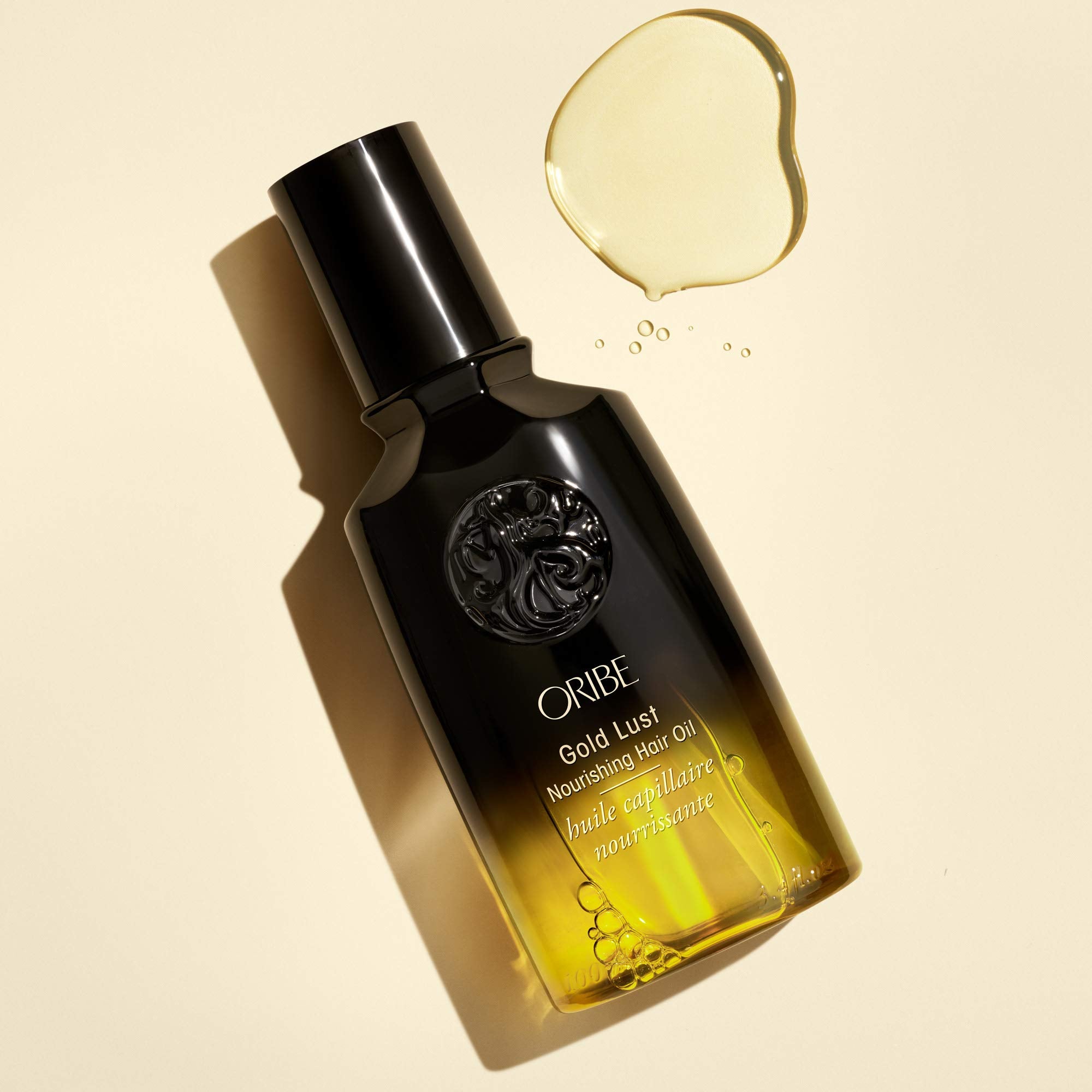 Smoothed dry hair with Oribe oil showing glossy finish and frizz reduction