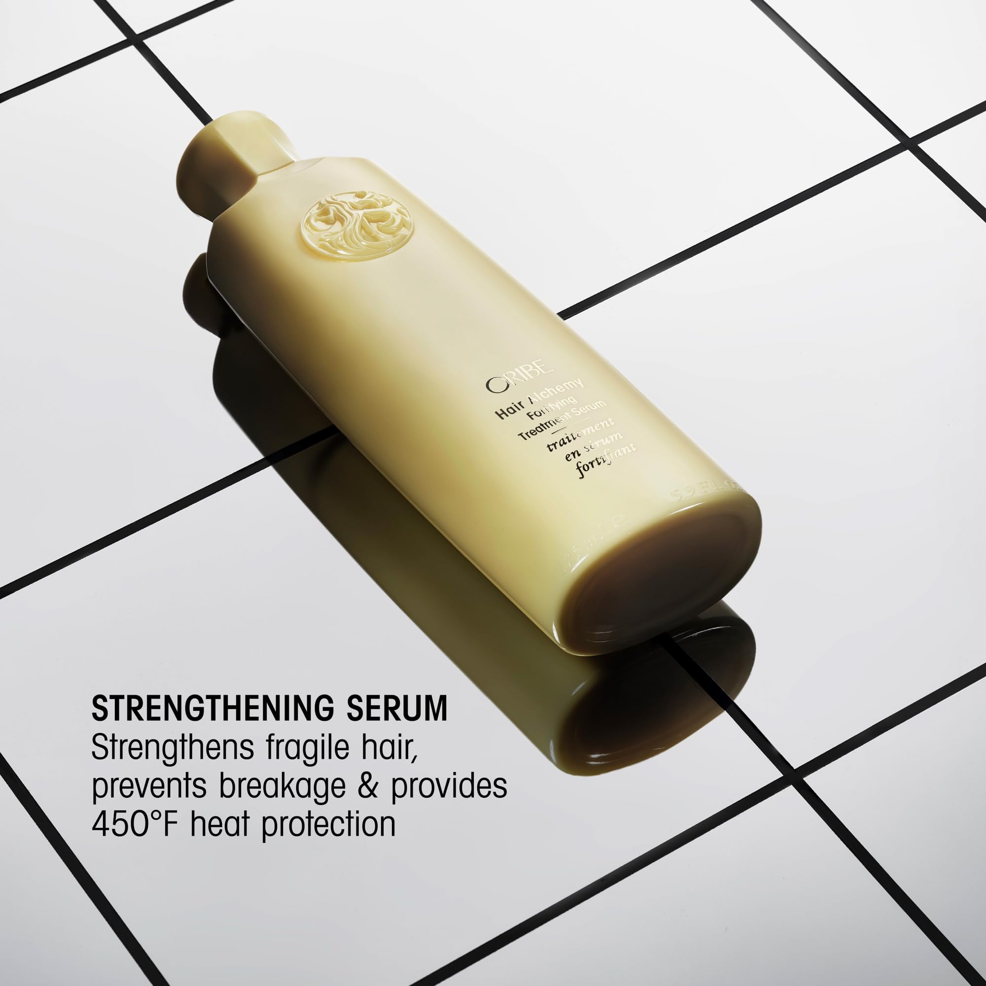 ORIBE serum pump detail that dispenses controlled amounts for efficient use