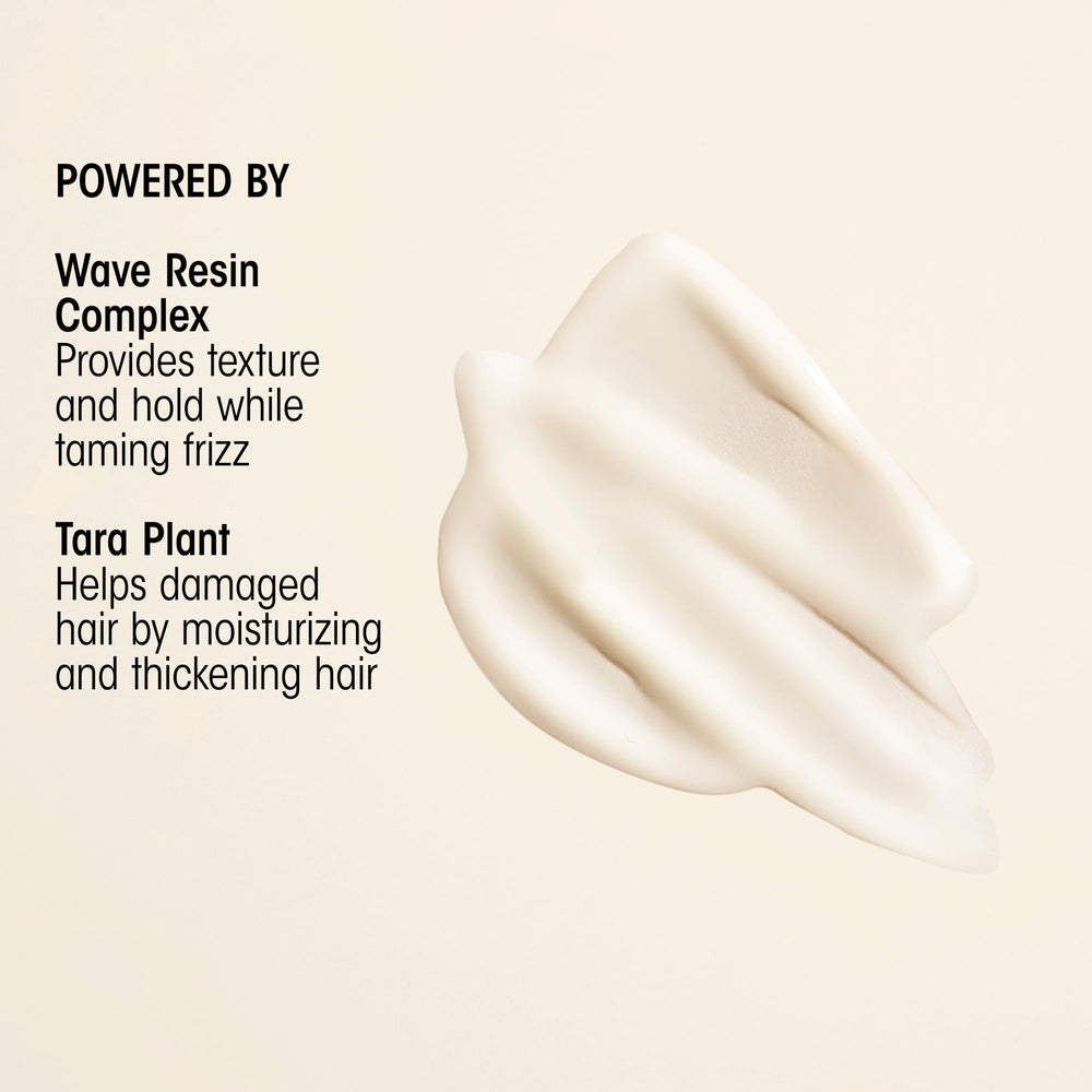 Applying Oribe Matte Waves to damp hair for beachy wave benefit