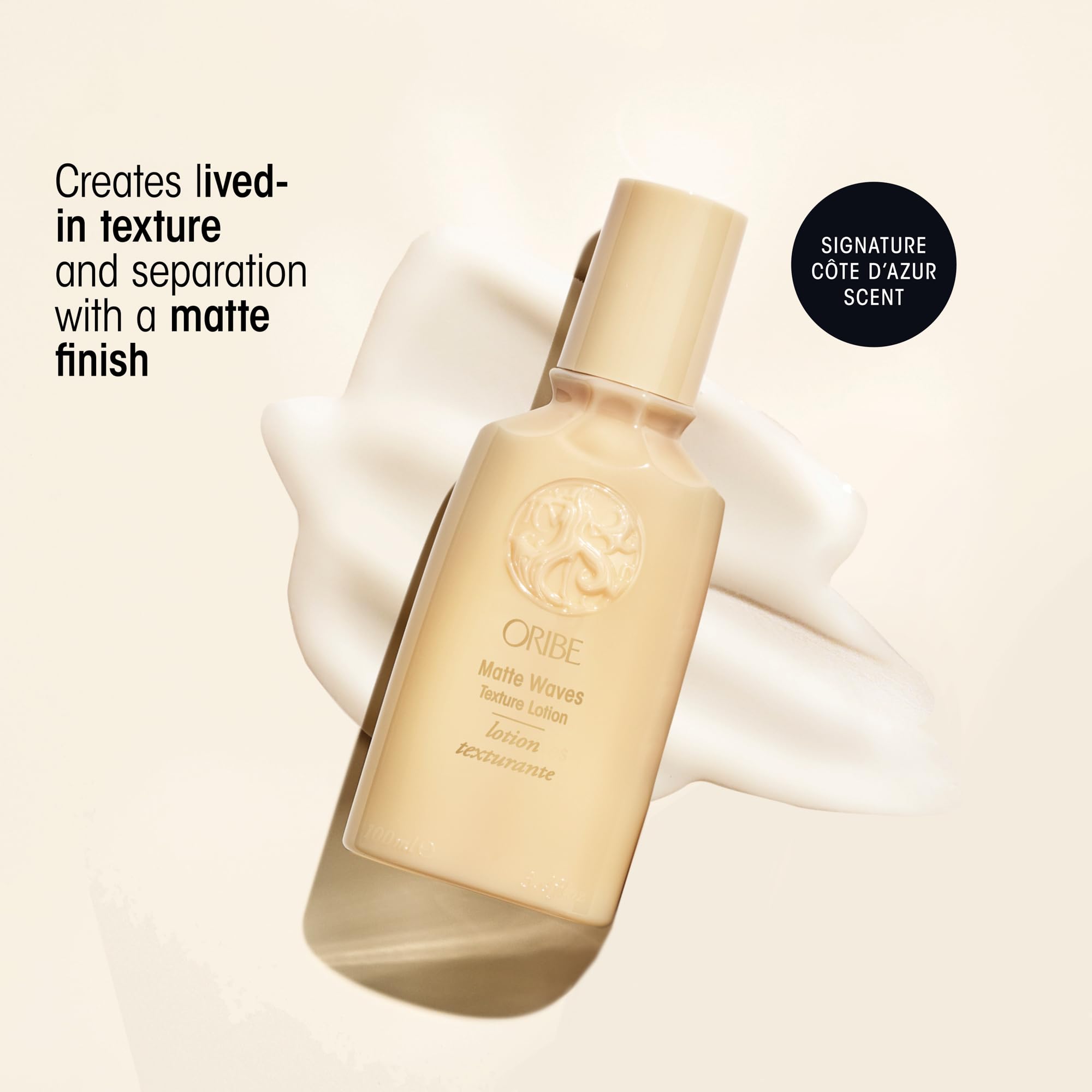 Close-up of Oribe Matte Waves cap being pulled off for use