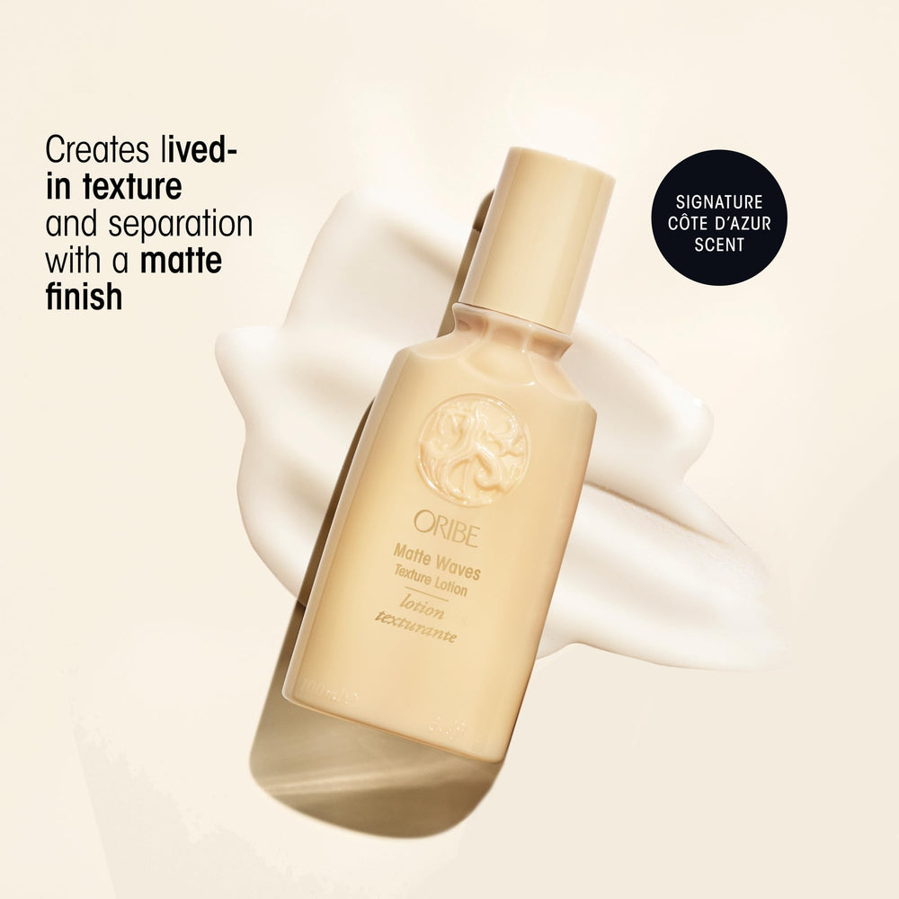 Close-up of Oribe Matte Waves cap being pulled off for use