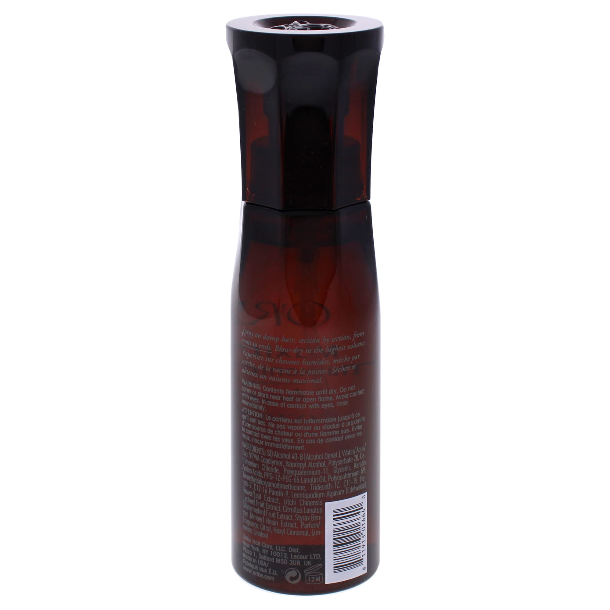 Oribe Maximista being sprayed on damp hair to add lift and heat protection