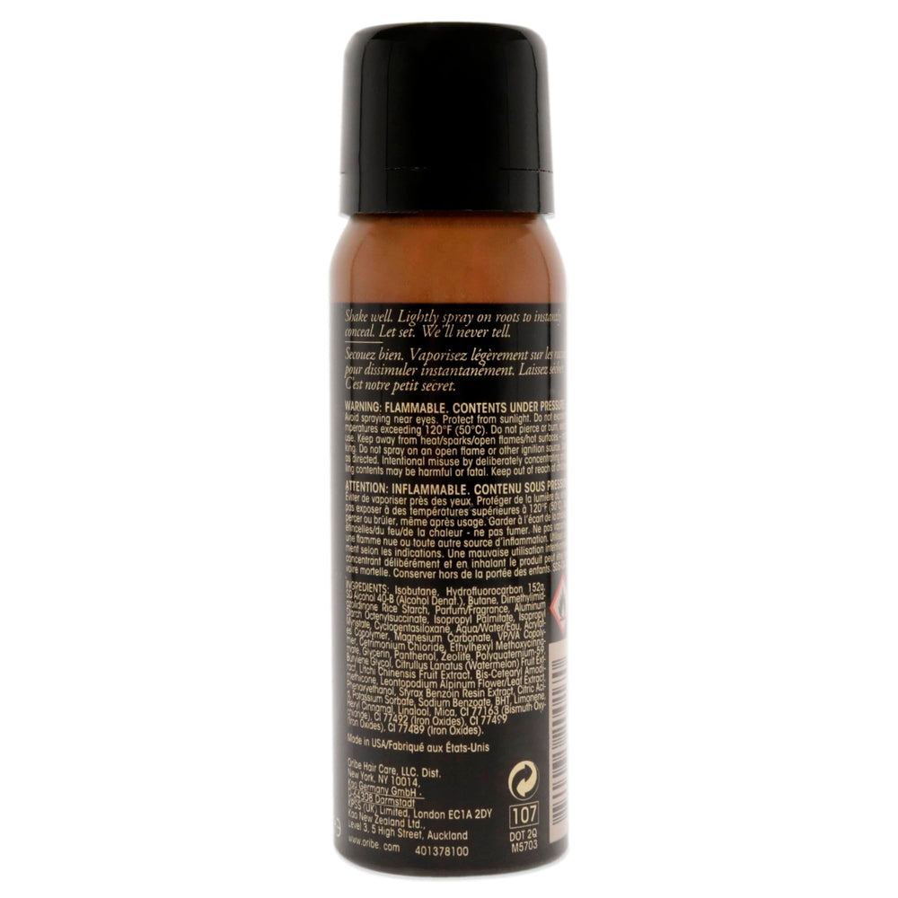 Oribe Root Touch-Up Spray applied on hair part to instantly conceal roots and reduce oil appearance
