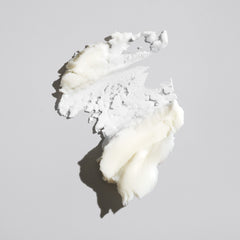Oribe product texture close-up showing creamy paste for easy moldability and hold