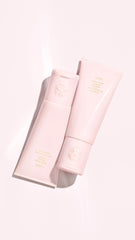 Oribe Serene in hand for size comparison showing convenient 6.8oz travel-friendly bottle
