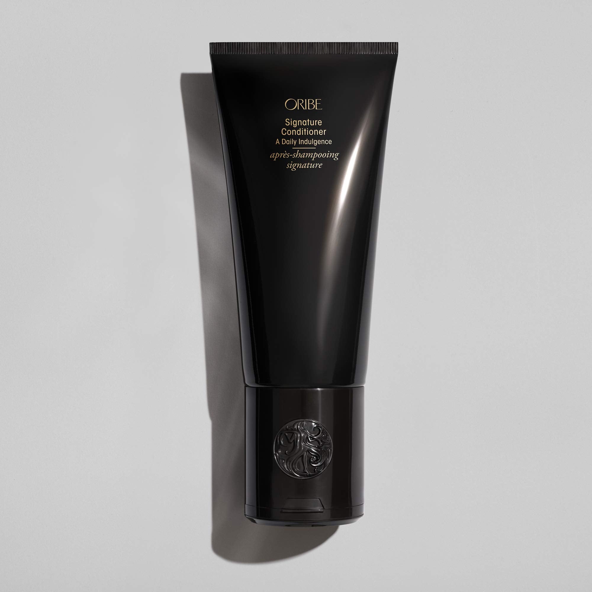 Creamy conditioner swatch from Oribe showcasing rich texture and hydrating finish