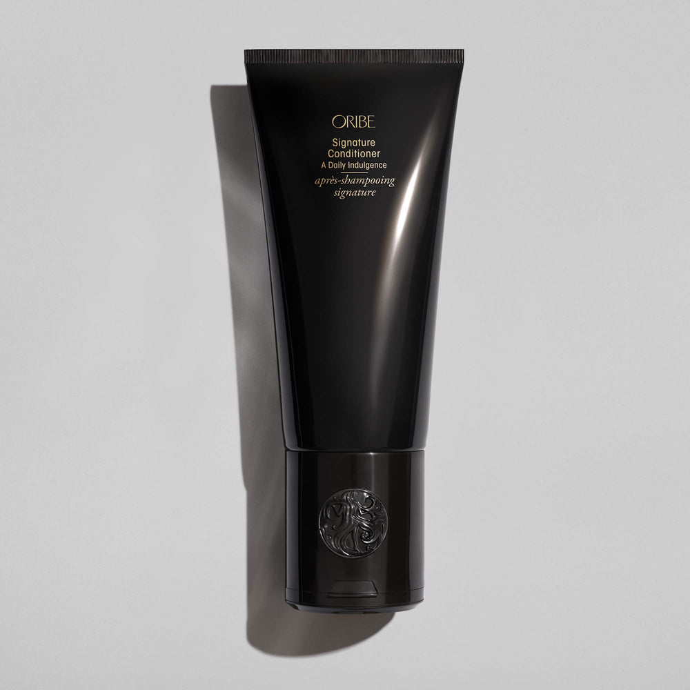 Creamy conditioner swatch from Oribe showcasing rich texture and hydrating finish