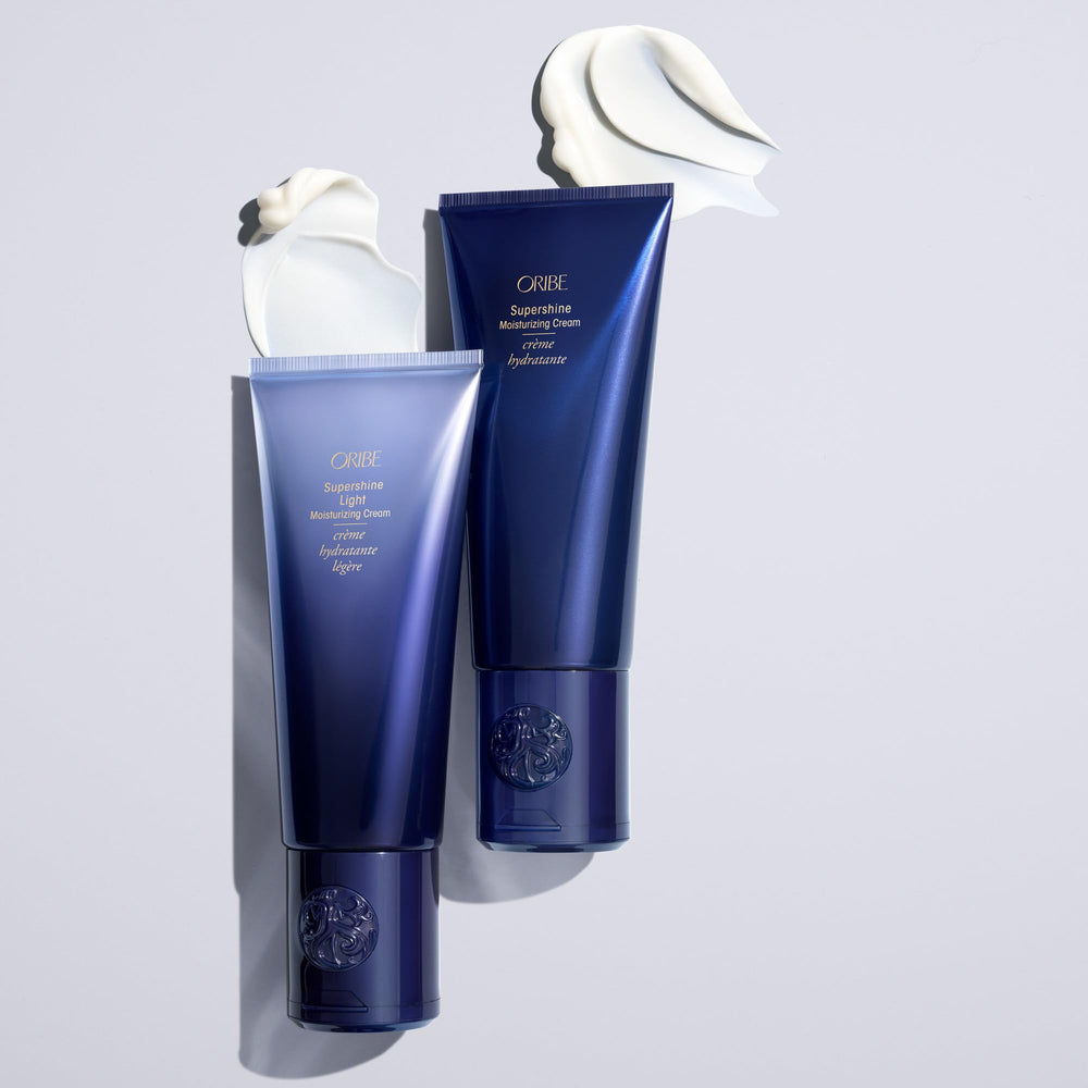 Oribe on bathroom vanity with towel setting conveying luxurious daily use