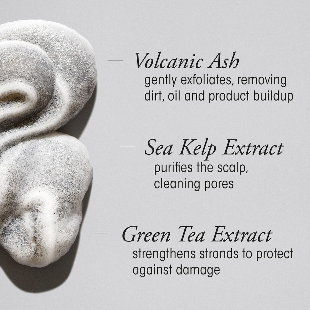 Oribe in-hand application showing mousse dispensed for even scalp coverage