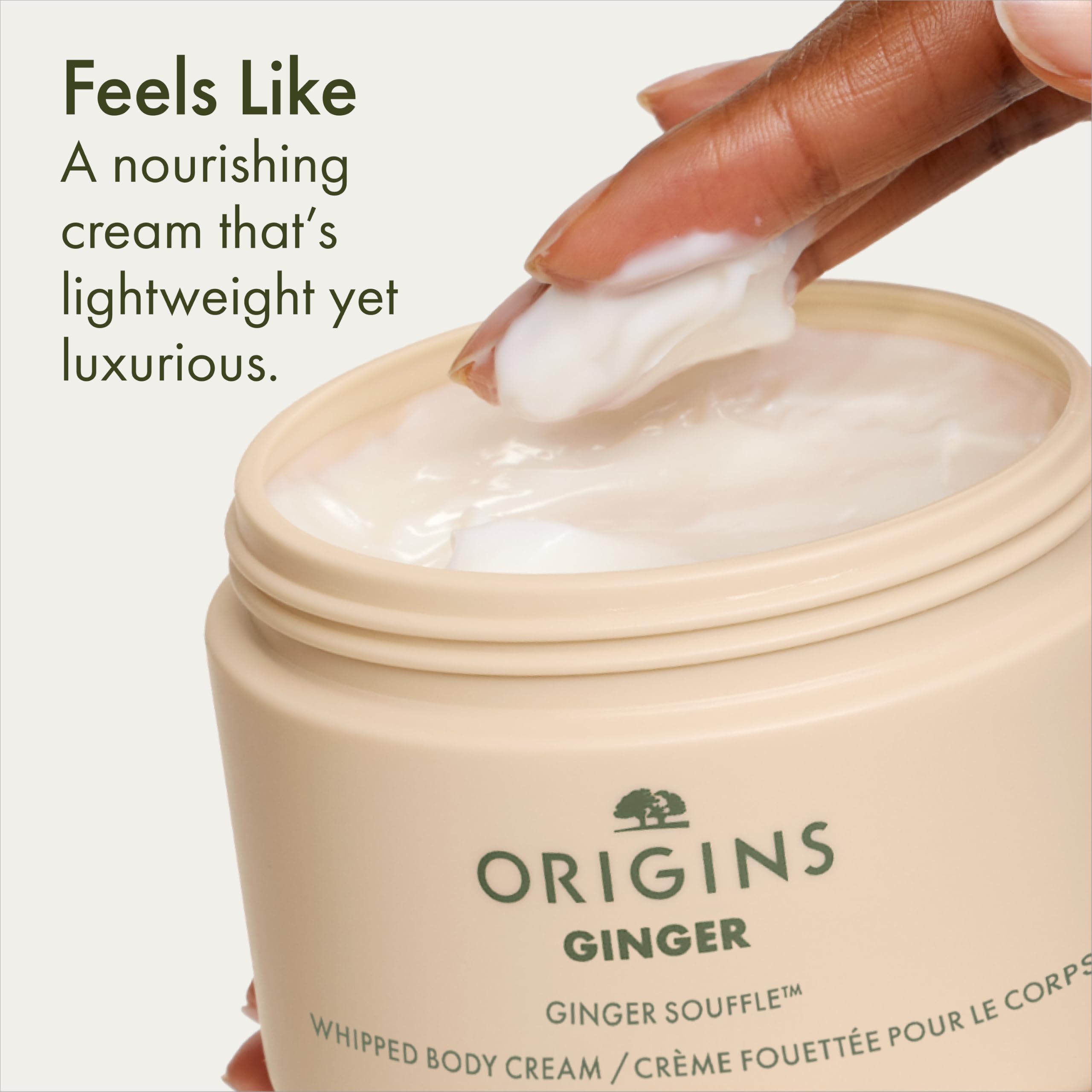 Origins jar held in hand to show 11.8 fl oz jumbo size and value