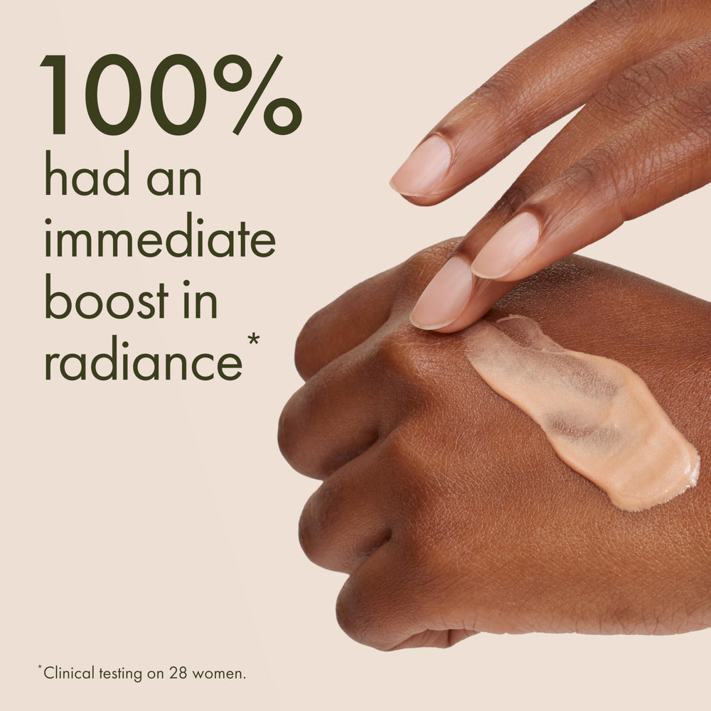 Origins GinZing swatch on skin showing warm bronze radiance and natural-looking glow