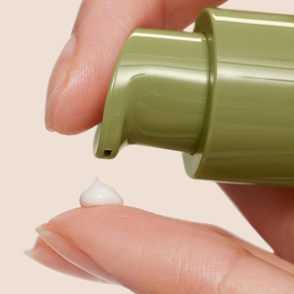 Origins Plantscription cream in hand demonstrating size and travel-friendly volume