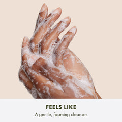 Origins Plantscription foam texture on hand illustrating gentle lather and easy rinsing