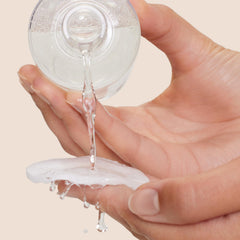 Origins Well Off applied to cotton pad removing mascara for efficient, gentle cleansing