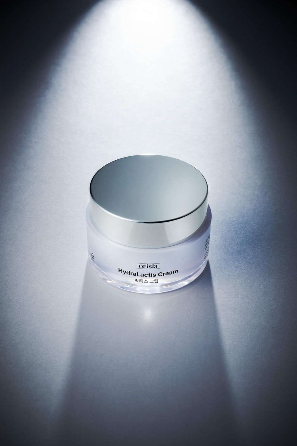 ORISIA HydraLactis dual-layer swirl demonstrating lightweight hydro-oil balance