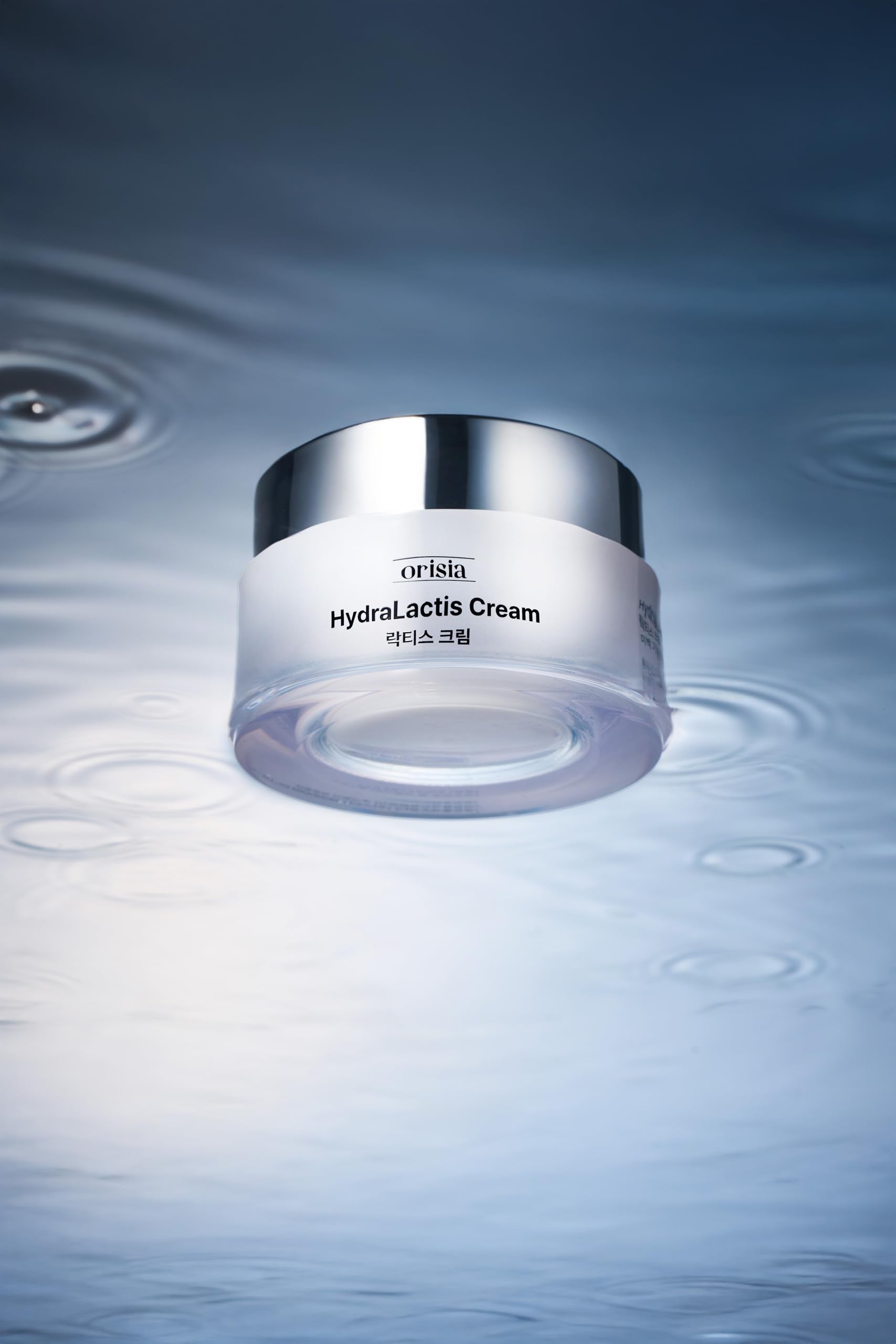 ORISIA HydraLactis next to a 50 ml scale showing travel-friendly size benefit