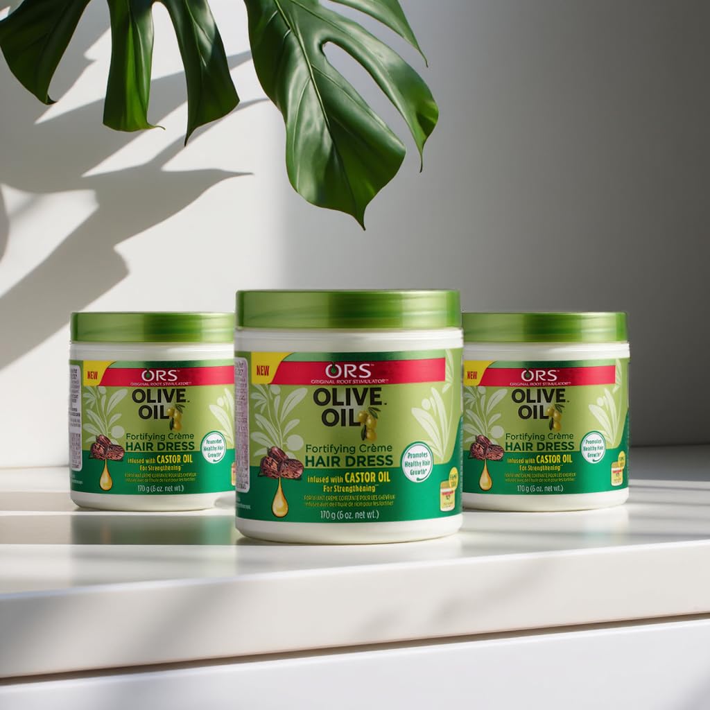 ORS olive oil cream on bathroom shelf in lifestyle setting showing everyday hair care use