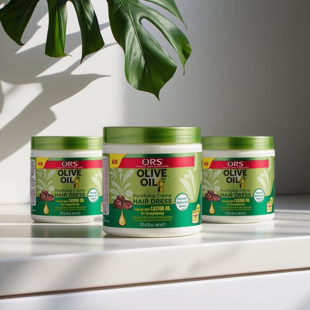 ORS olive oil cream on bathroom shelf in lifestyle setting showing everyday hair care use