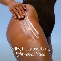 OSEA applying body lotion to forearm demonstrating fast-absorbing finish