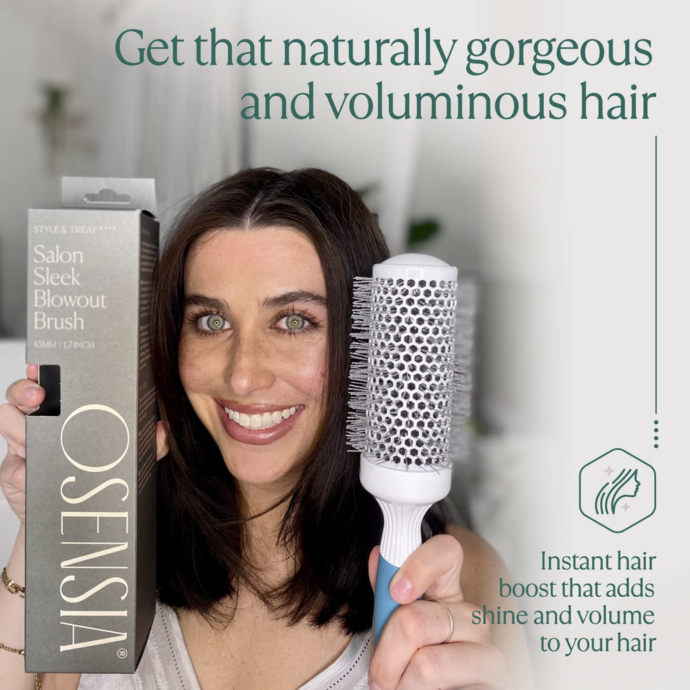 Osensia brush held in hand for size comparison showing comfortable grip