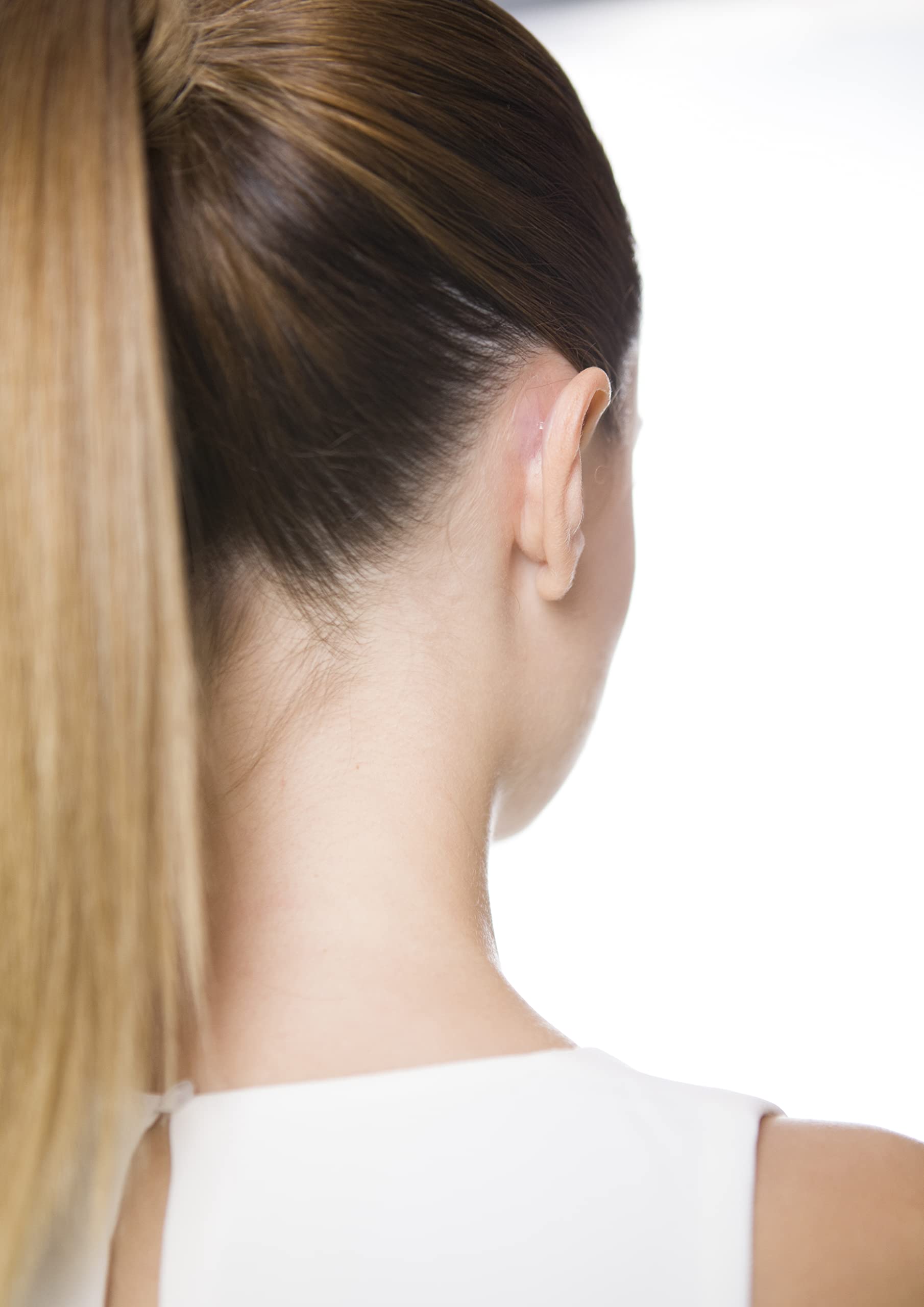 Otostick worn with hairstyle showing subtle, natural appearance