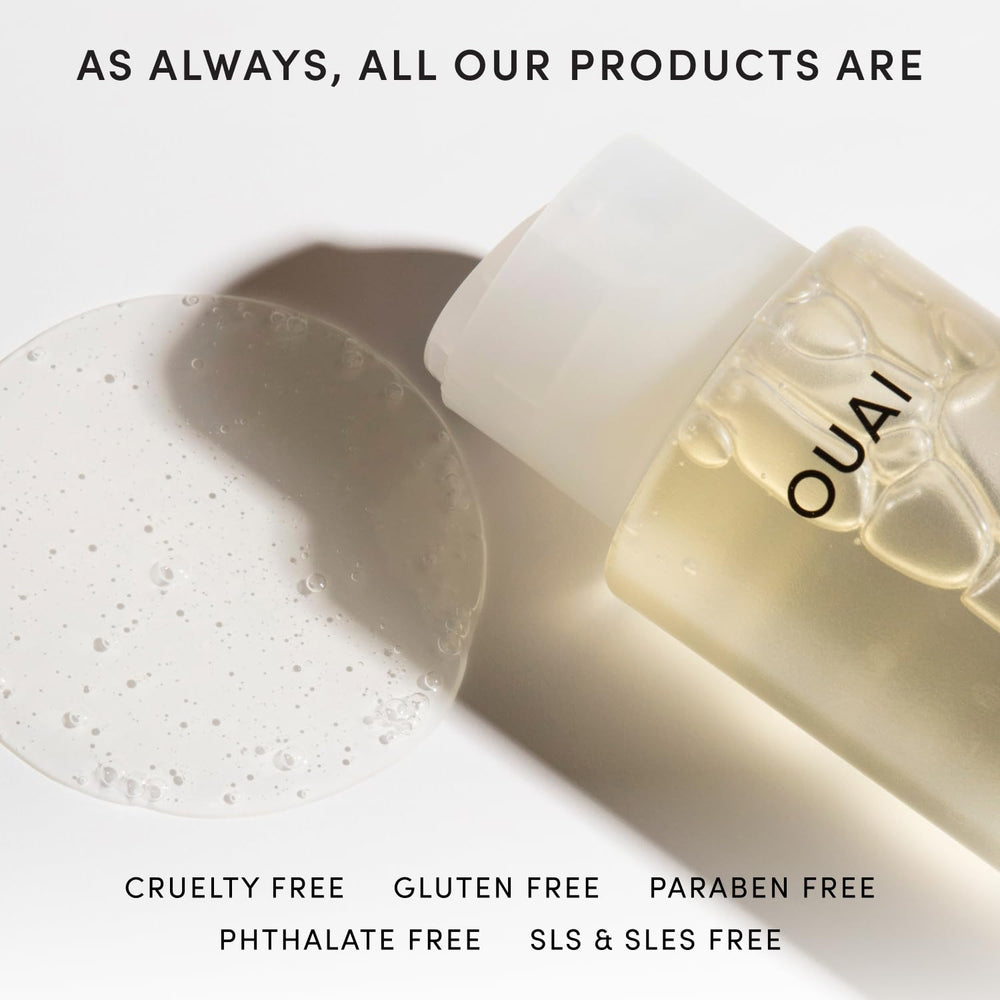 OUAI label detail showing biotin and keratin callouts to reduce breakage and add shine