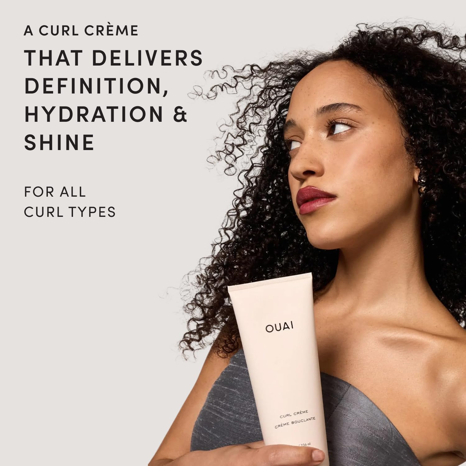 OUAI curl cream dispensing into palm demonstrating easy application