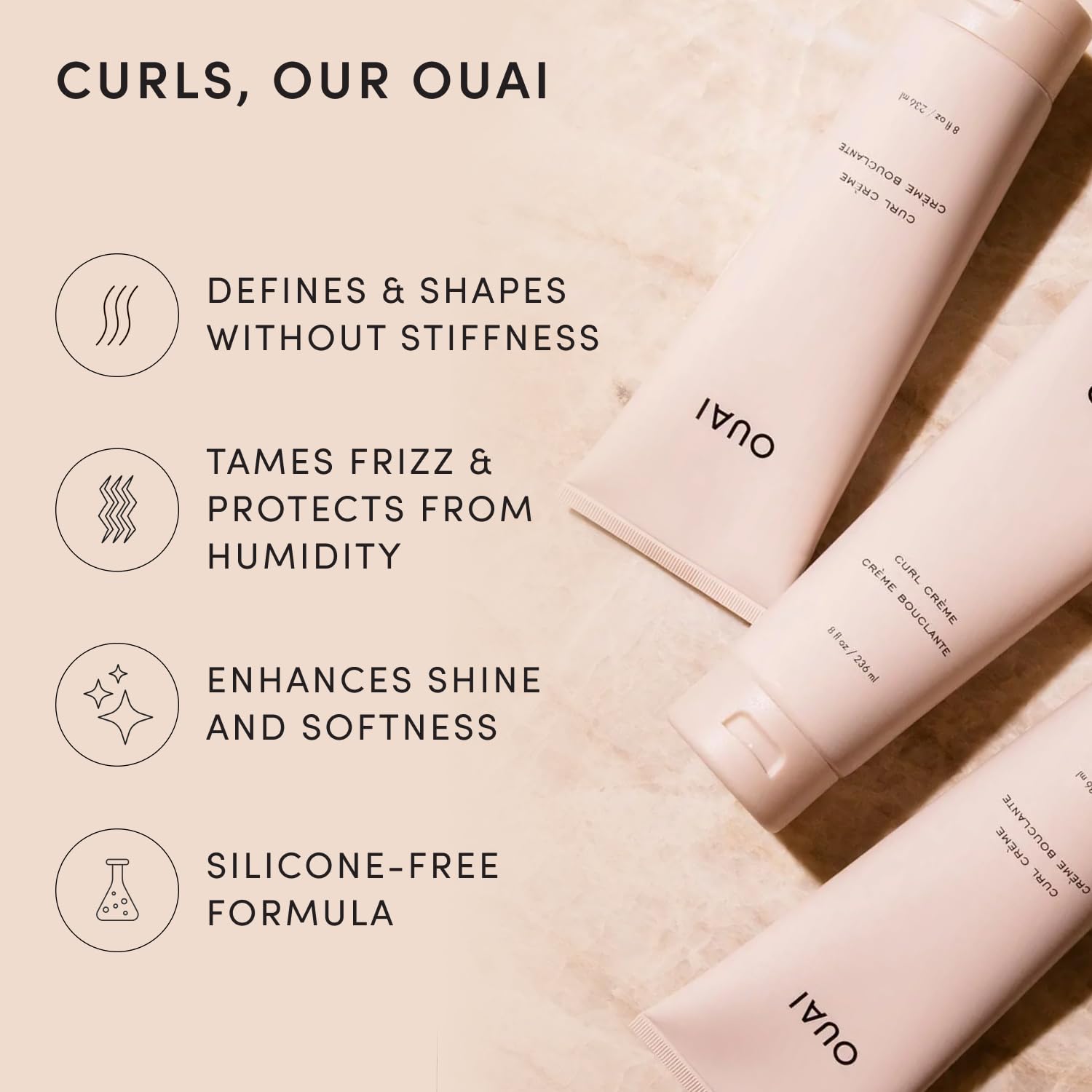 OUAI curl cream texture close-up highlighting creamy hydrating formula