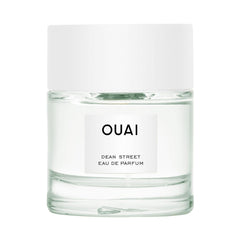 OUAI bottle front view showing elegant glass and label for everyday wear