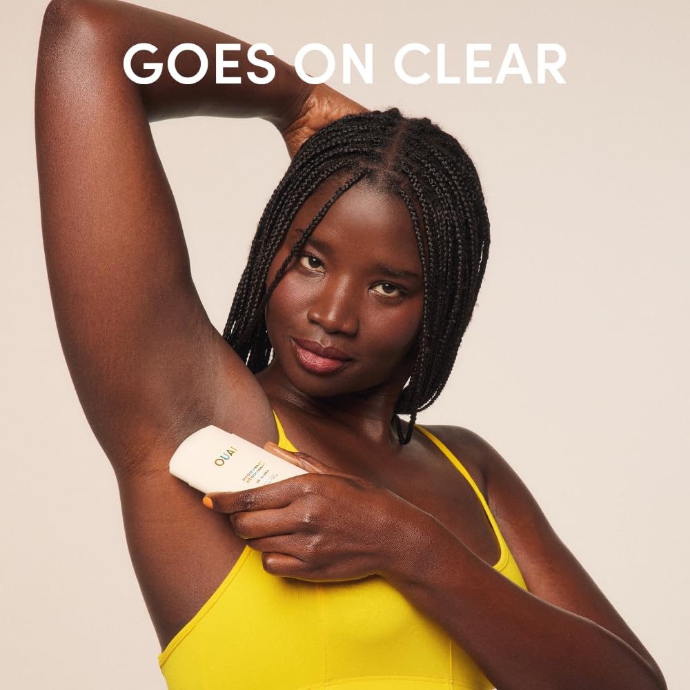 OUAI deodorant beside a phone to show compact travel size