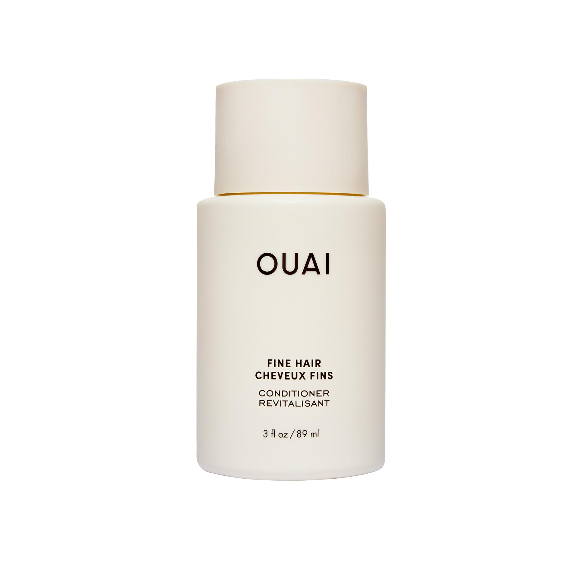 OUAI front view of travel conditioner tube shows brand and easy packing benefit