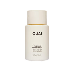 OUAI front view of travel conditioner tube shows brand and easy packing benefit