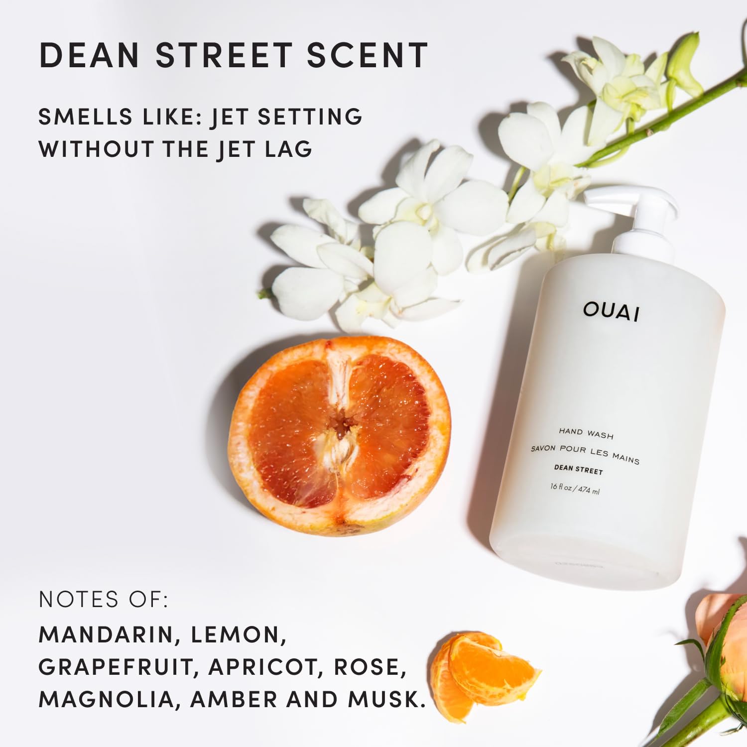 OUAI bottle beside a hand showing 16 fl oz scale for practical size reference