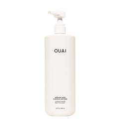 OUAI medium front bottle showing 32 oz size and clean design benefit longevity