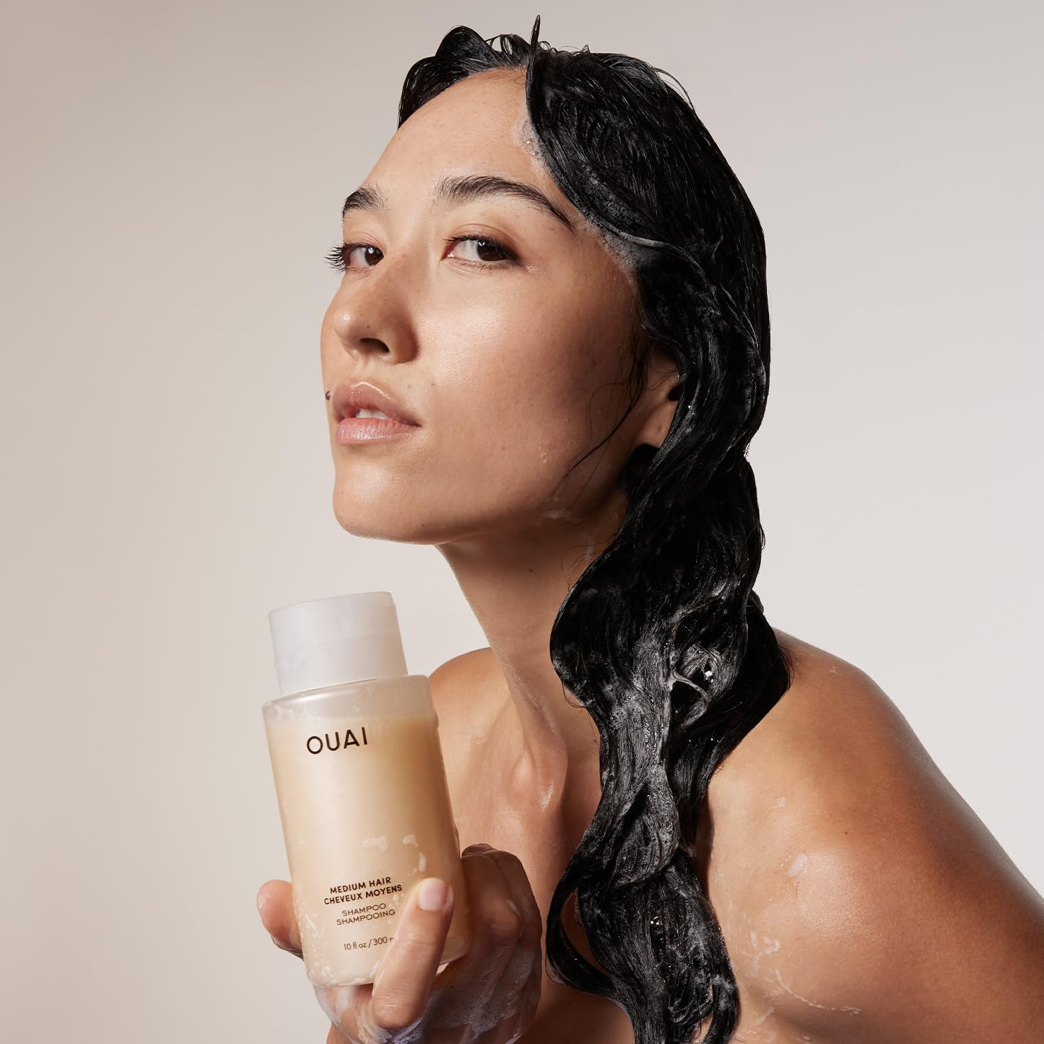 OUAI Medium shampoo texture close-up highlighting lather and moisturizing feel