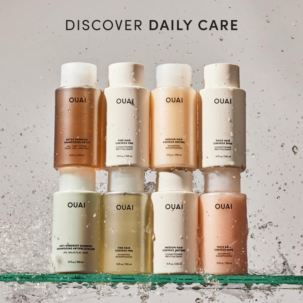 OUAI 10 fl oz bottle beside common object to display size and travel-friendly volume